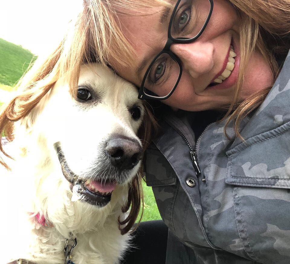 Becky Lea posing with a dog